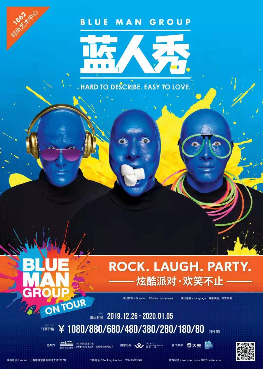 Promotional poster for the Blue Man Group's tour, featuring the iconic blue-faced performers against a vibrant yellow and black splash background