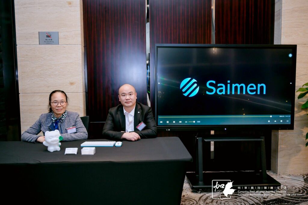 Saimen team members welcoming guests at their booth during CIIE in Shanghai.